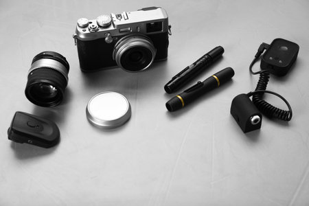 Different professional photographer's equipment on light backgroundの写真素材