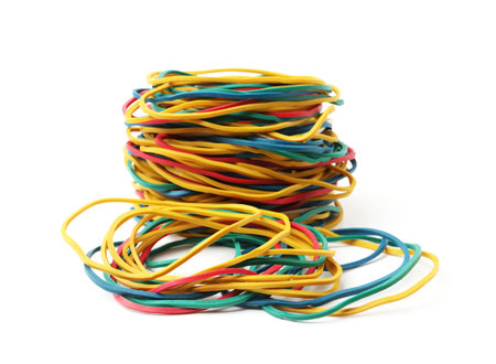 Many colorful rubber bands isolated on white