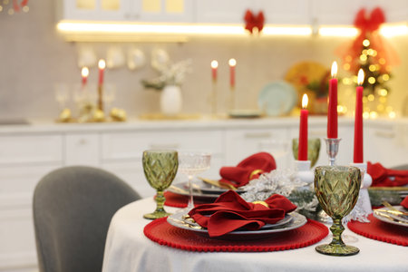 Festive table setting with Christmas decor in kitchen, closeup. Interior designの写真素材