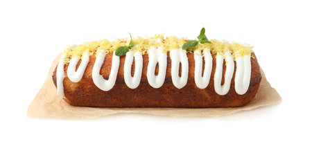 Tasty lemon cake decorated with icing, zest and mint isolated on whiteの写真素材