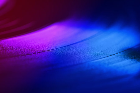 Vinyl record, closeup view. Toned in pink and blue gradient