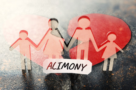 Divorce and alimony concept. Family figure on table and heart broken, double exposureの写真素材