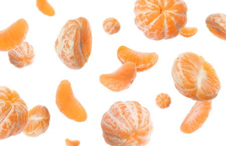 Fresh tangerines falling on white background. Citrus fruitの写真素材