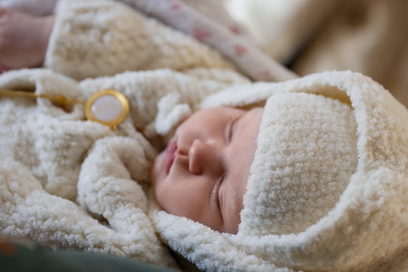 Father holding his child during baptism ceremony in church, closeupの写真素材