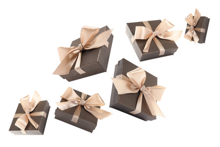 Gift boxes flying in air on white background