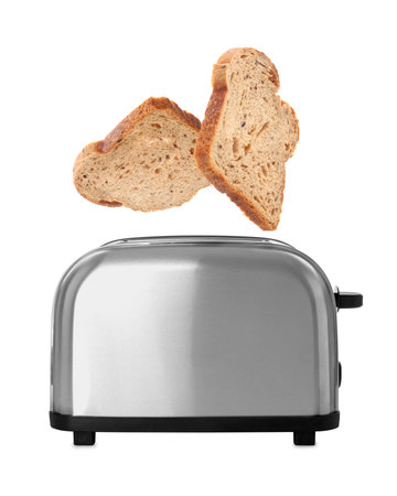 Bread slices flying into toaster on white background