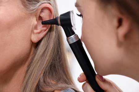 Hearing test. Doctor examining patient