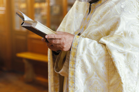 Priest with Holy Bible in church, closeup