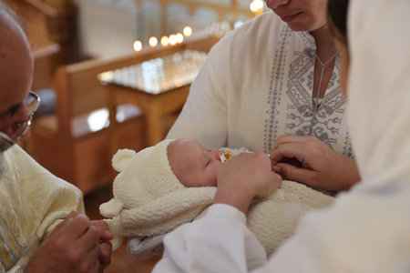 Mykolaiv, Ukraine - November 1, 2025: Priest conducting baptism ceremony in church, closeup