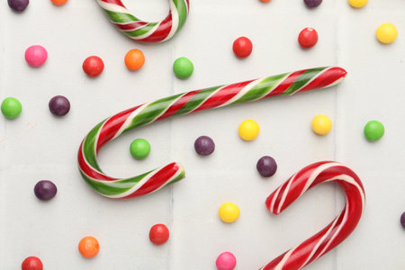 Delicious colorful candies on white table, flat layの写真素材
