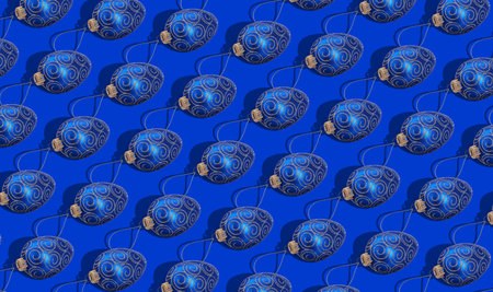 Christmas pattern design of festive balls on blue background