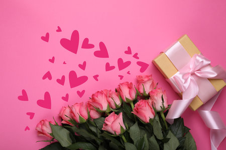 Bouquet of roses, gift box and hearts on pink background, top view. Romantic greeting cardの写真素材