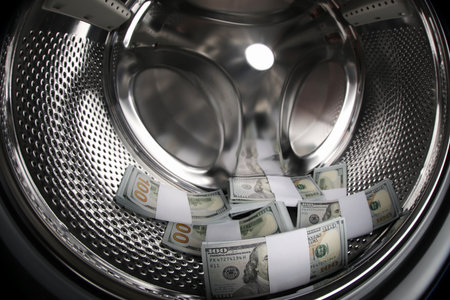Many dollar banknotes in washing machine, closeupの写真素材