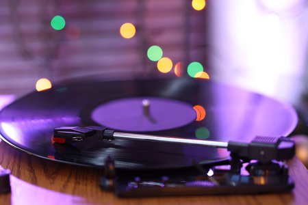 Turntable with vinyl record on table, closeupの写真素材