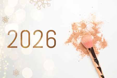 Makeup brush, crushed decorative cosmetic product on white background, top view