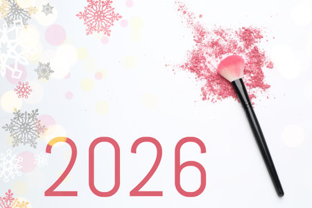 Makeup brush, crushed decorative cosmetic product on white background, top view