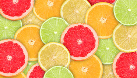 Citrus fruits as background, top view. Slices of orange, grapefruit, lemon and lime