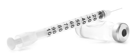 Vaccine in vial and syringe isolated on white