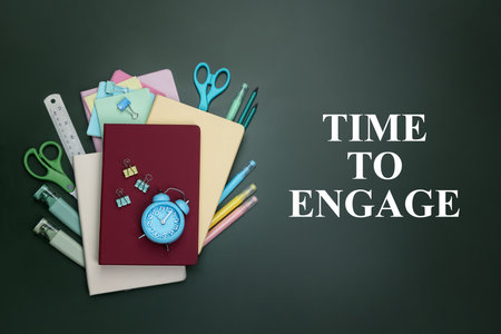 Time To Engage written on chalkboard with alarm clock and stationery, flat layの写真素材
