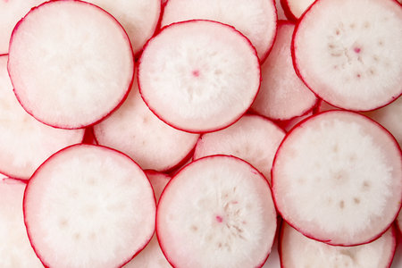 Slices of fresh radishes as background, top viewの写真素材