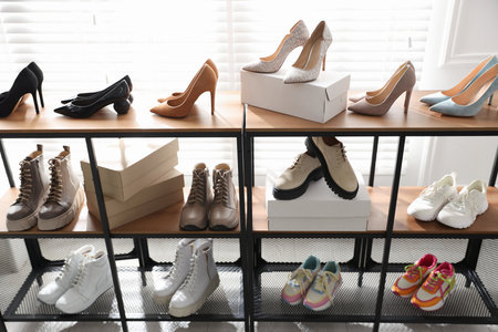 Shoe storage with different footwear in storeの写真素材
