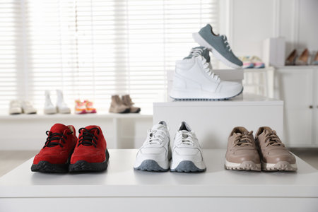 Many new different pairs of shoes in storeの写真素材