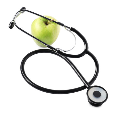 Ripe apple and stethoscope isolated on whiteの写真素材