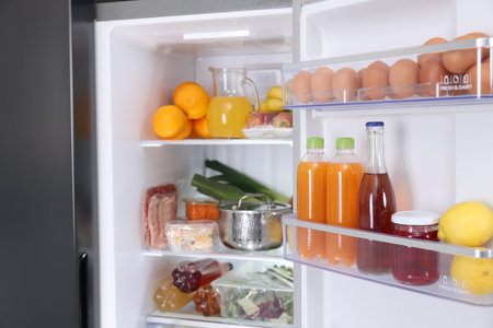 Modern refrigerator with different fresh food productsの写真素材