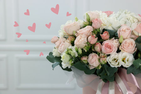 Bouquet of beautiful flowers and hearts on romantic greeting cardの写真素材