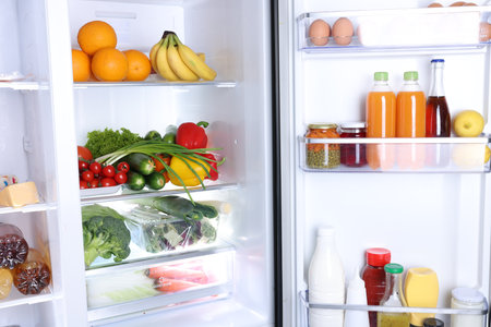 Modern refrigerator with different fresh food products, closeupの写真素材
