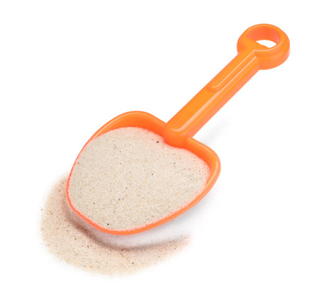 Plastic shovel with sand isolated on white. Children's beach toyの写真素材