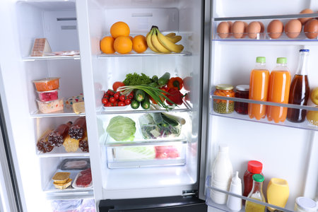 Modern refrigerator with different fresh food products, closeupの写真素材