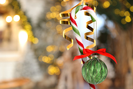 Beautiful Christmas decor hanging against blurred background. Winter holidays greeting cardの写真素材