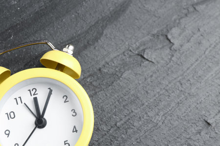 Alarm clock on black table, top view. Space for textの写真素材