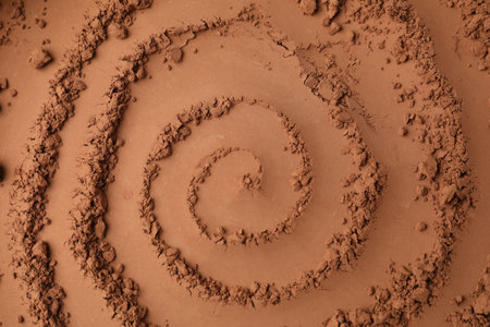 Natural cocoa powder as background, top view