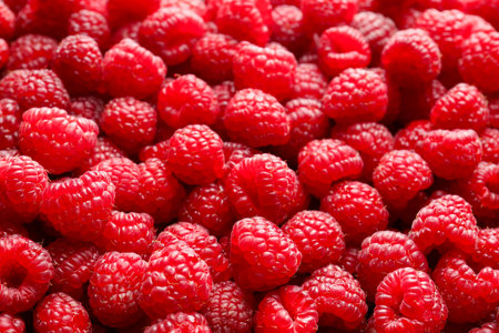 Fresh ripe raspberries as background, closeup view
