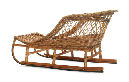 One beautiful wicker sleigh isolated on whiteの写真素材