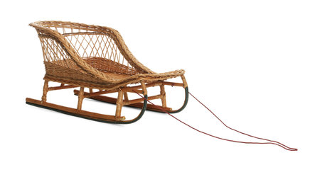 One beautiful wicker sleigh isolated on whiteの写真素材