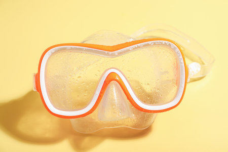 One diving mask on yellow background, closeupの写真素材