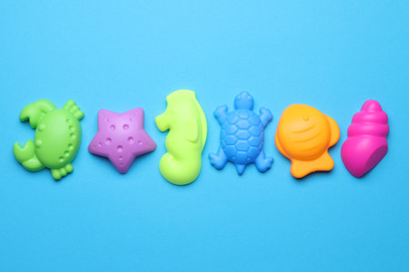 Children's beach toys on light blue background, flat layの写真素材
