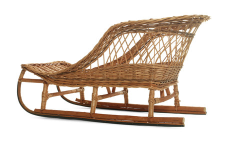 One beautiful wicker sleigh isolated on whiteの写真素材