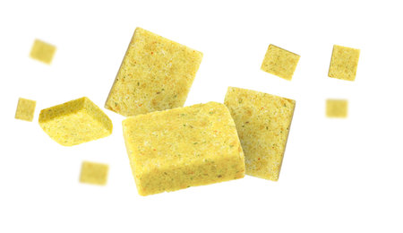 Bouillon cubes flying in air on white backgroundの写真素材