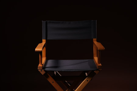 Film director's chair on dark brown backgroundの写真素材