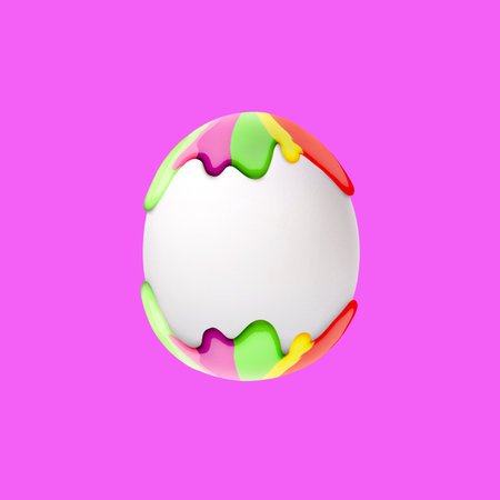 Easter egg in colorful paint on magenta backgroundの写真素材