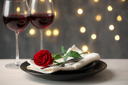 Beautiful place setting with rose on light wooden, closeupの写真素材