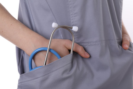 Doctor with stethoscope in pocket on white background, closeupの写真素材