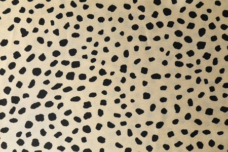 Texture of beige fabric with pattern as background, top view
