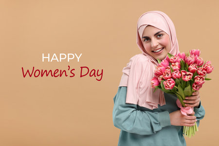 Happy muslim woman in hijab with bouquet of tulips celebrating International Women's day. Dark beige...