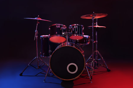 Drum kit in color lights against black background