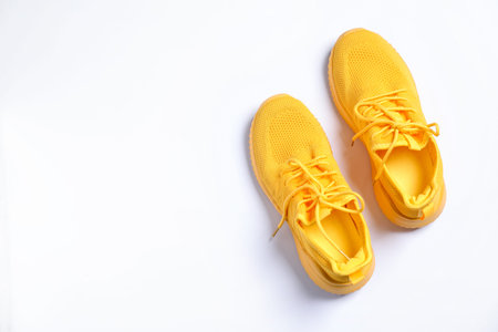 Pair of stylish sneakers on white background, top view. Space for textの写真素材